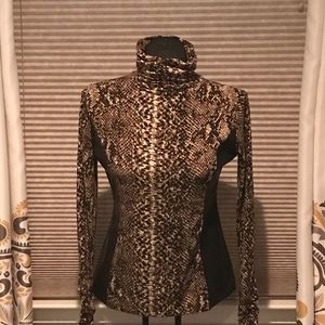 Snake print turtleneck with faux leather on side.